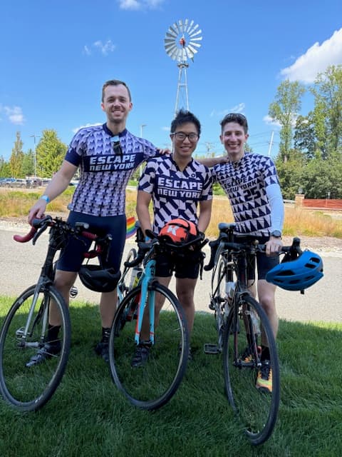 Three riders with bikes ready to ride